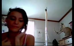 Gorgeous brunette masturbates on skype cam while talking on phone
